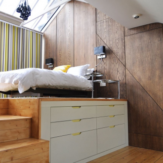 Bedroom in a studio apartment with storage