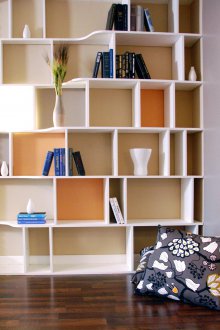 The shelving in the living room is multilevel