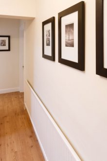 Wall panels for a corridor with a radiator