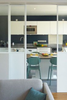 Living room kitchen design with doors