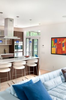 Living room kitchen design with blue sofa