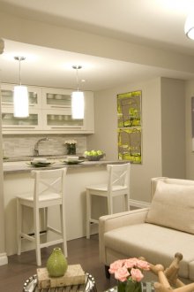 Living room kitchen design with green decor