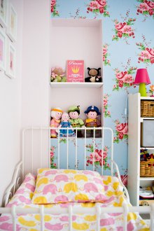 Nursery decor with floral wallpaper