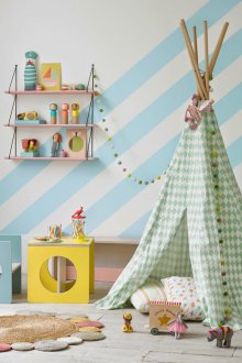 The decor of the striped walls of the children's room