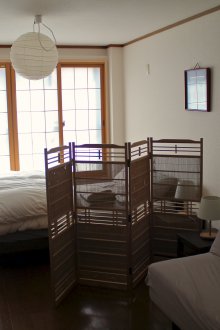 Japanese-style studio apartment with a screen
