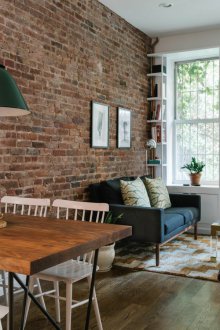 Styles of one-room apartments with a brick wall