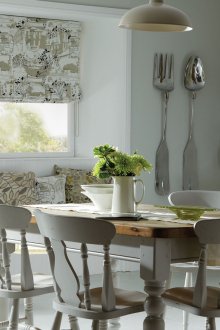 Thick Roman curtains with a pattern in the kitchen