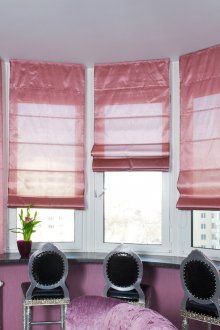 Pink roman curtains above the bar